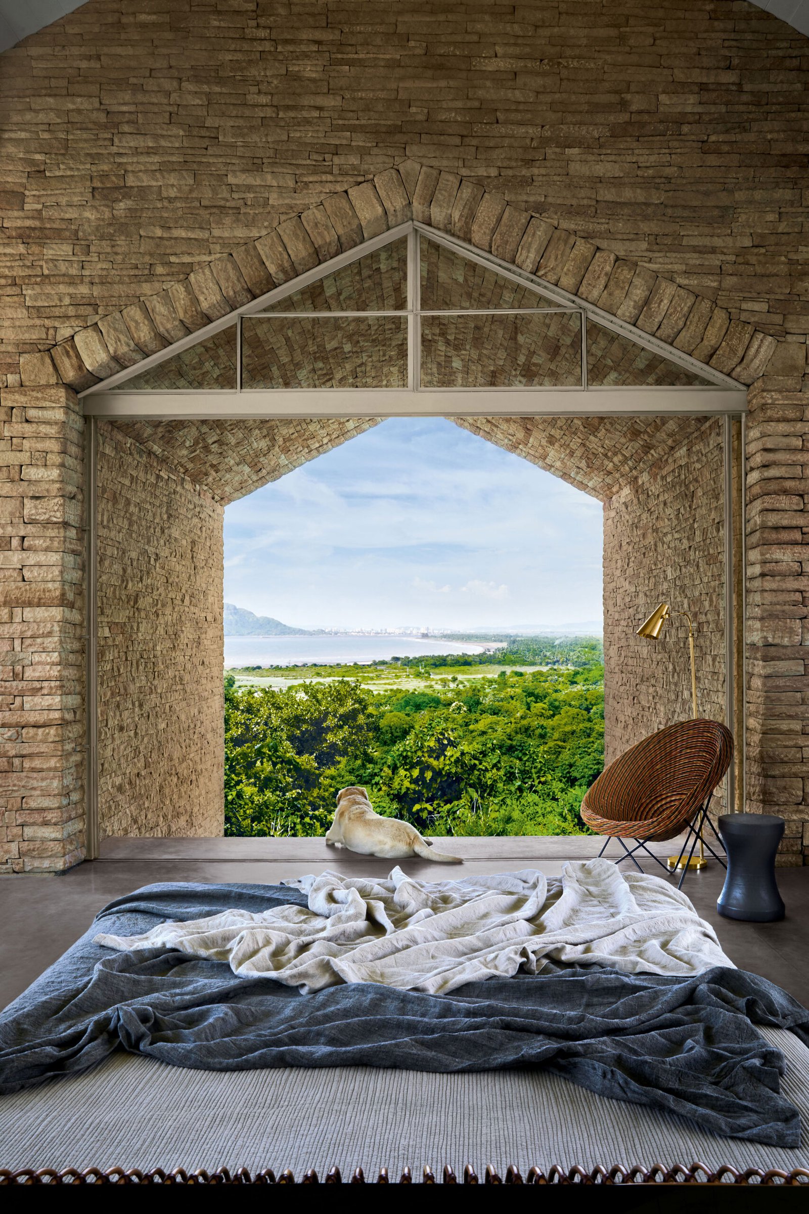 view framed by cave-like stone window frame