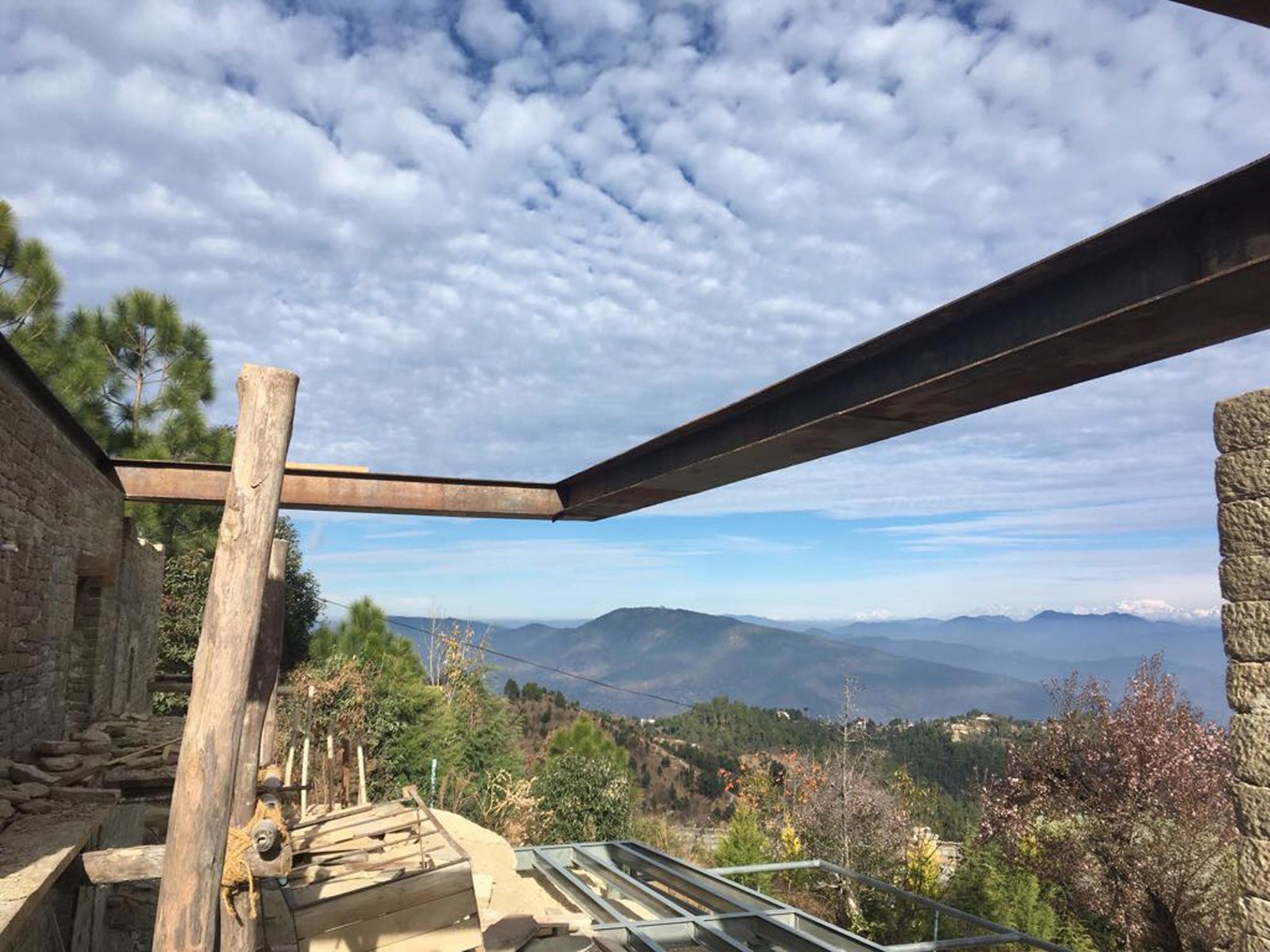 bedroom corner cantilevered steel beam mountain home Uttarakhand