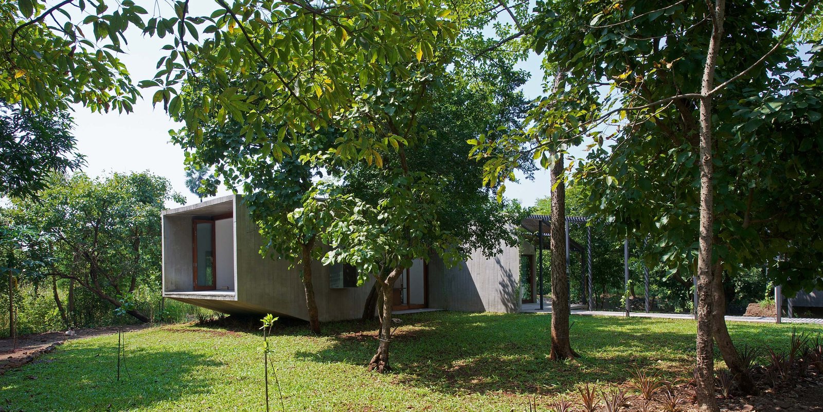 cantilevered balcony house on a stream Alibaug india