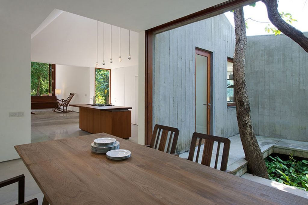 dining room island kitchen and courtyard house on a stream Alibaug india