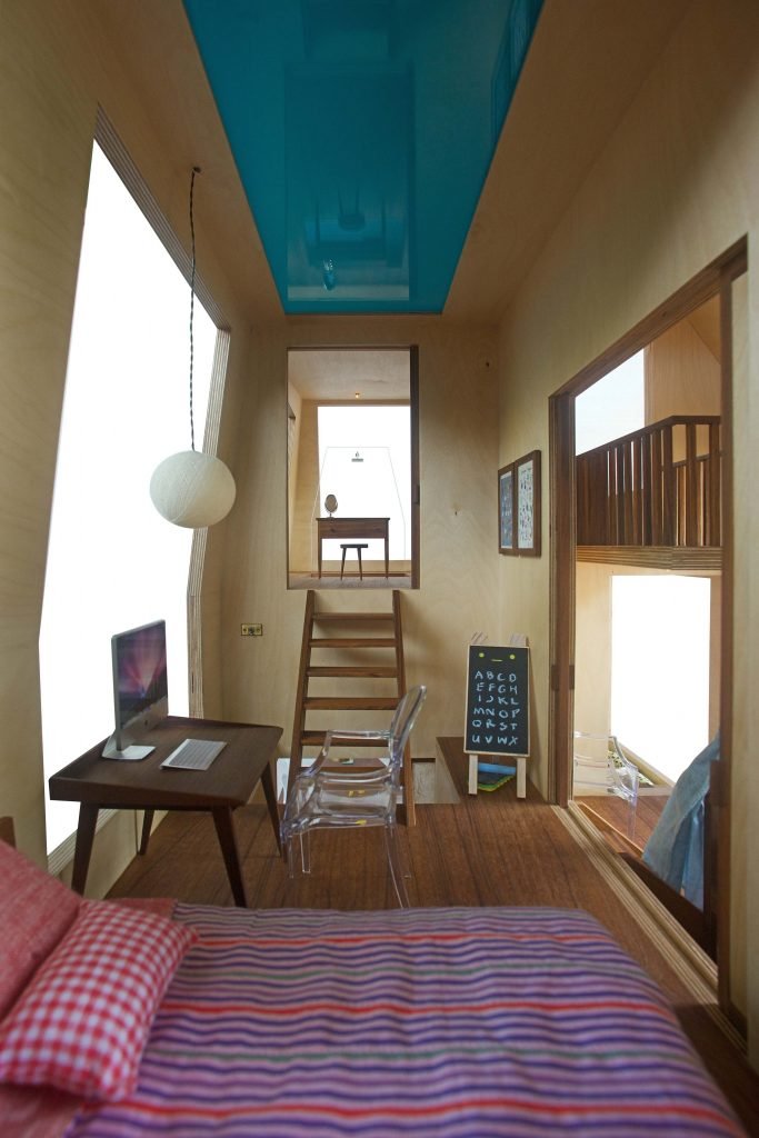 dollhouse with kids room looking into bathroom with pool above by architecture firm in Mumbai