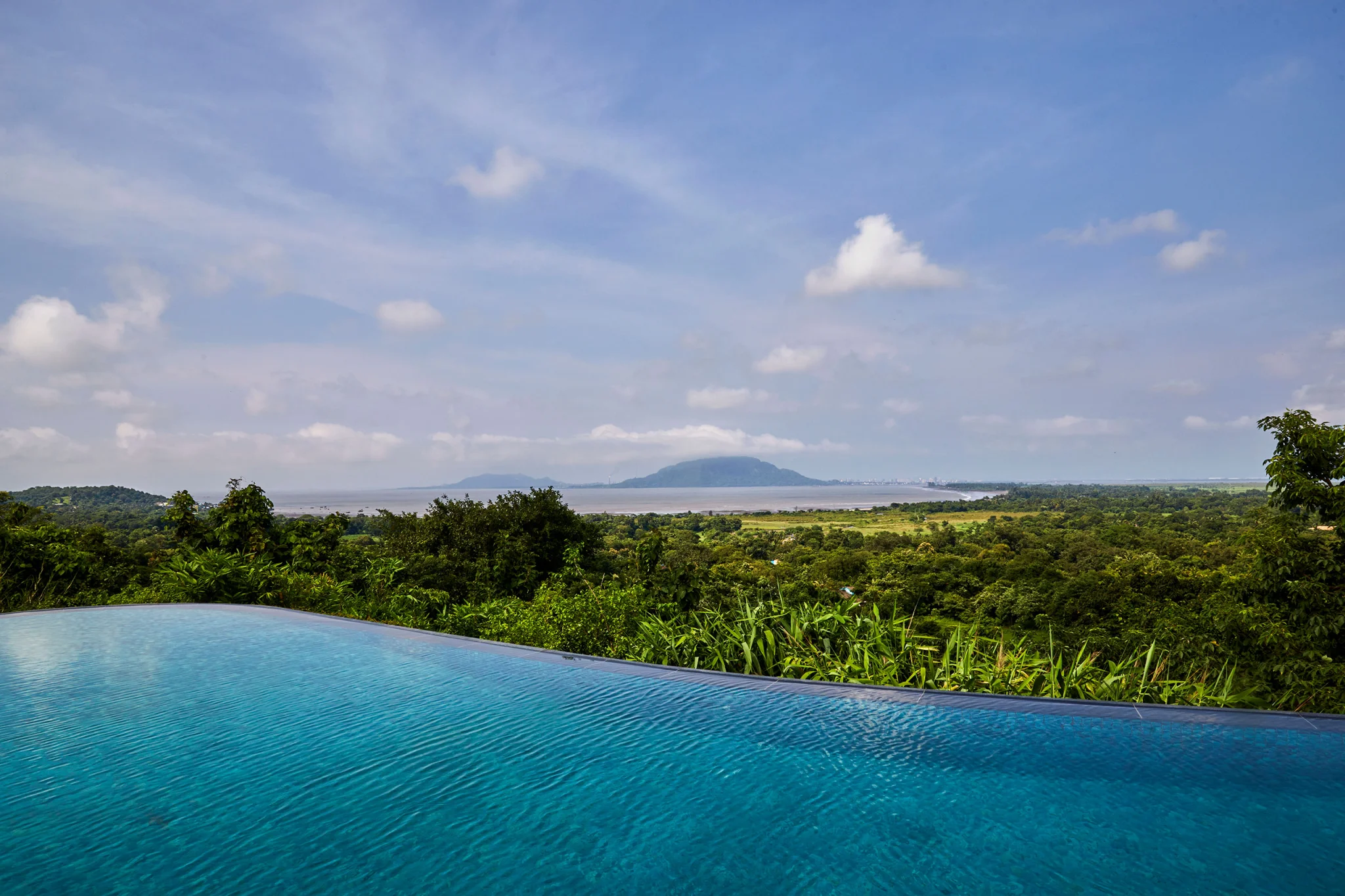 infinity pool with view of Mumbai city and bay in alibag